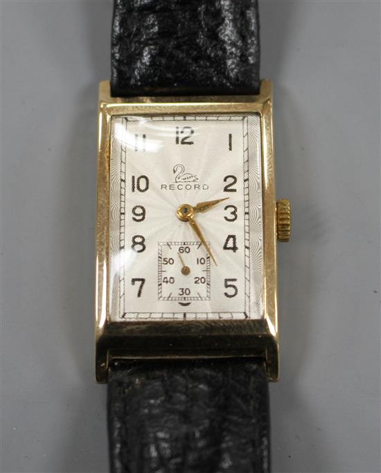 A gentlemans 1950s 9ct gold Record manual wind wrist watch, with rectangular starburst Arabic dial and subsidiary seconds,